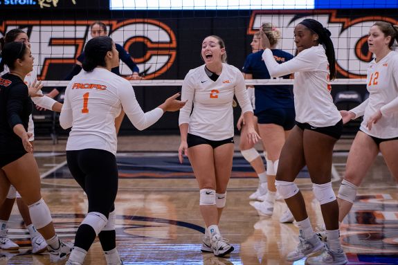 The team celebrates after a point.