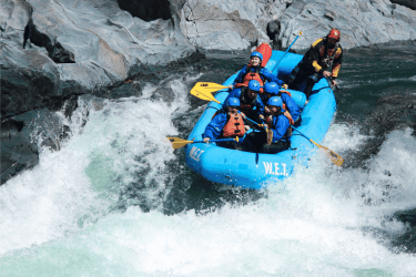 Bue Raft on a big river rapid