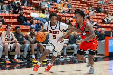 Pacific men's basketball player drives to the basket