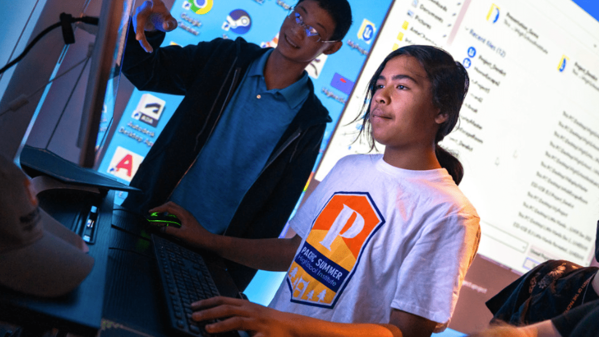 Two students looking at a computer screen