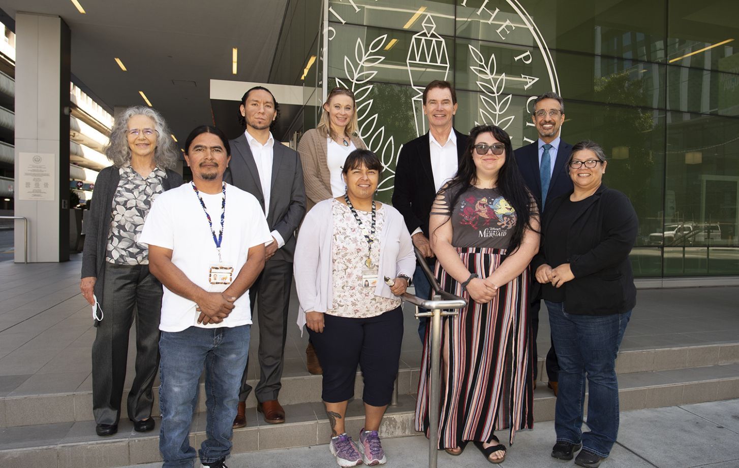Group of tribal participants standing in front of the Dugoni School of Dentistry