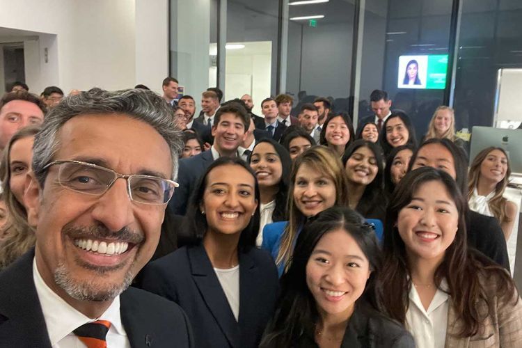 Dean Nadershahi posing with a group of people at the Dugoni School