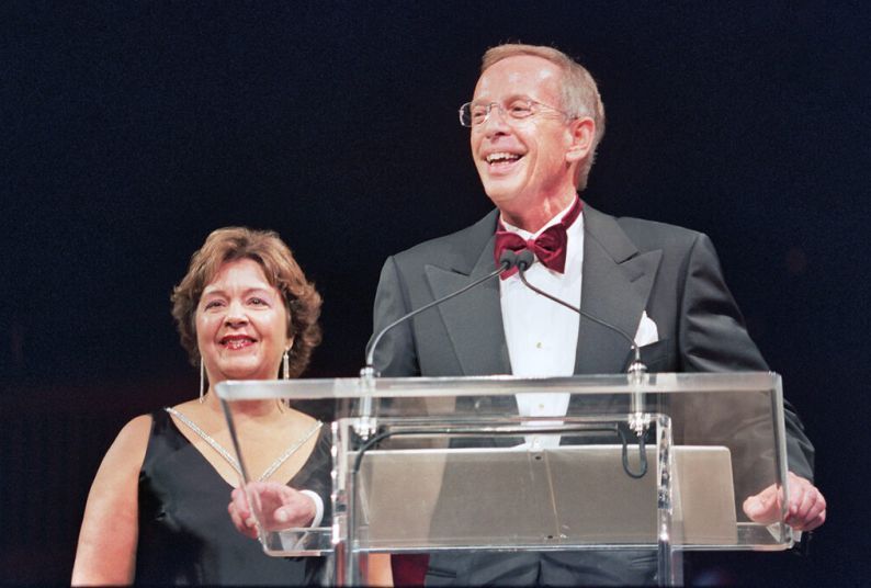 Robert H. Christoffersen stands at a podium with alumna Debra Finney '86 