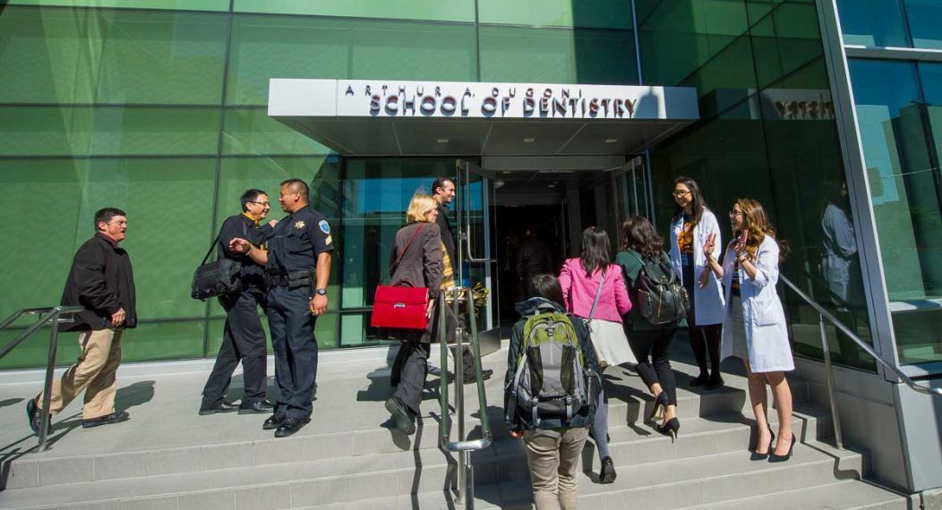 students, staff and faculty at entrance to San Francisco campus