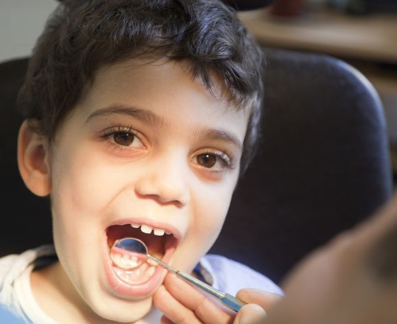 child showing off teeth